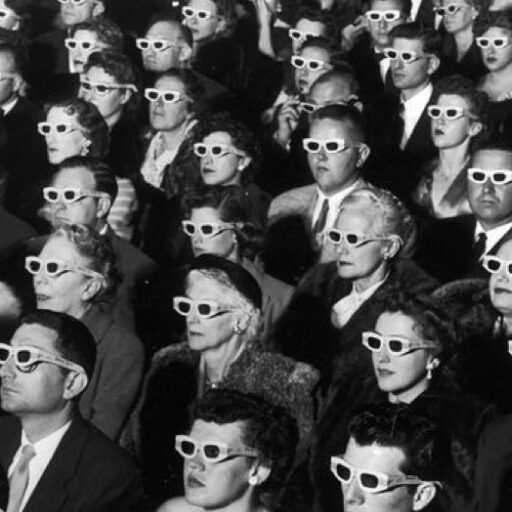 audience wearing 3D glasses