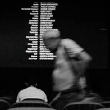person leaving movie theatre seats as credits roll